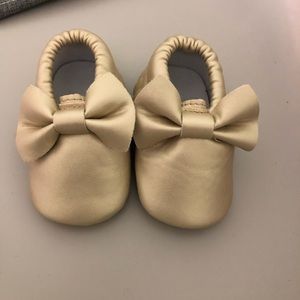Gold bow moccasins
